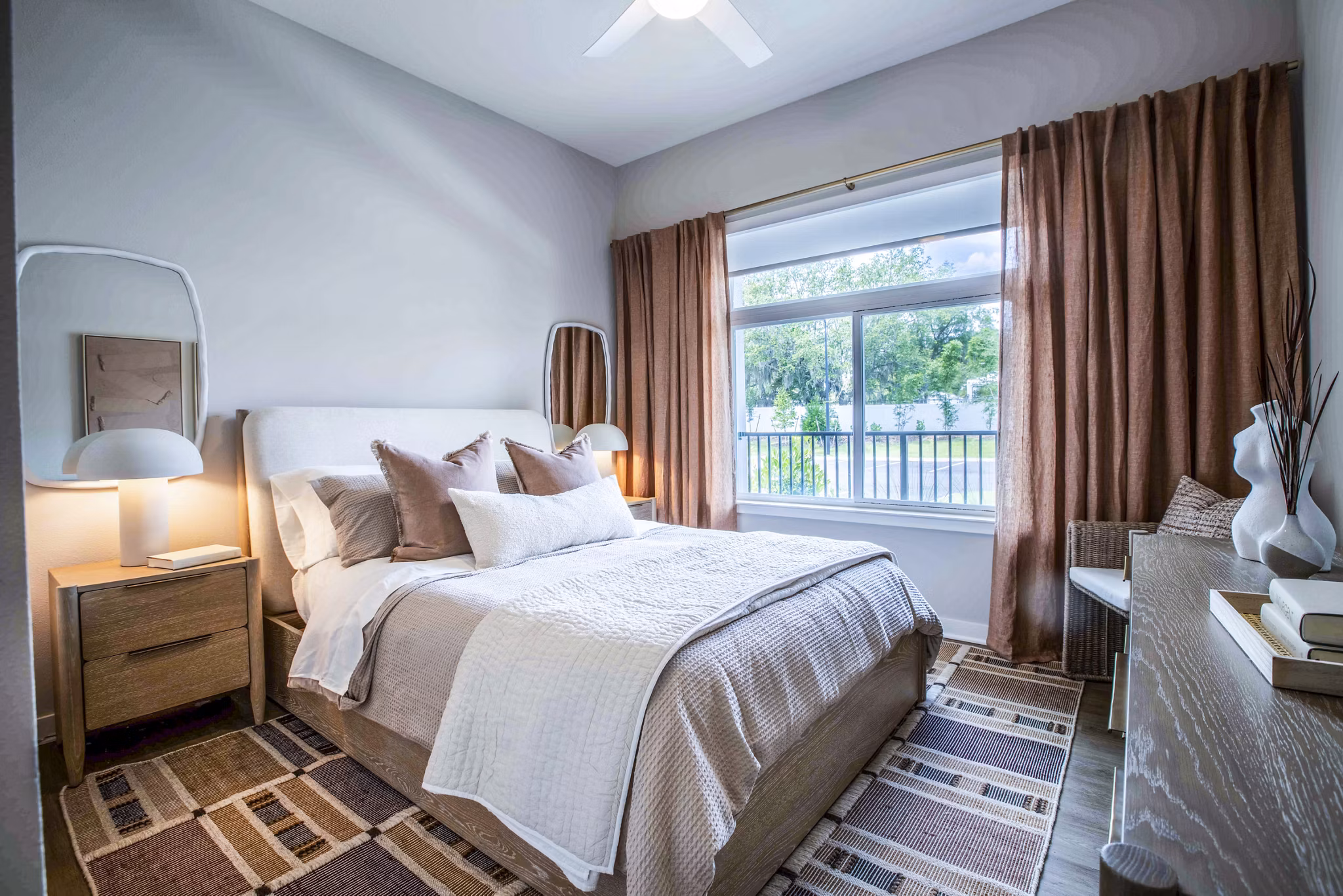 Cozy bedroom with elegant decor at Lynwind Apartments