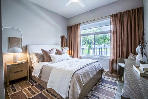 Cozy bedroom with elegant decor at Lynwind Apartments