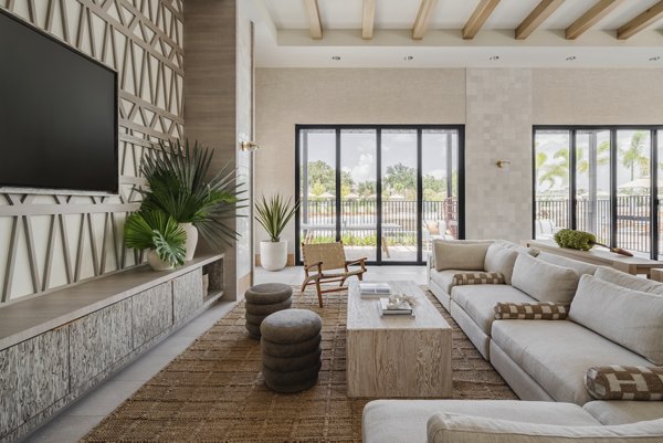 Lynwind Apartments: Stylish clubhouse featuring modern decor and communal seating in Riverview