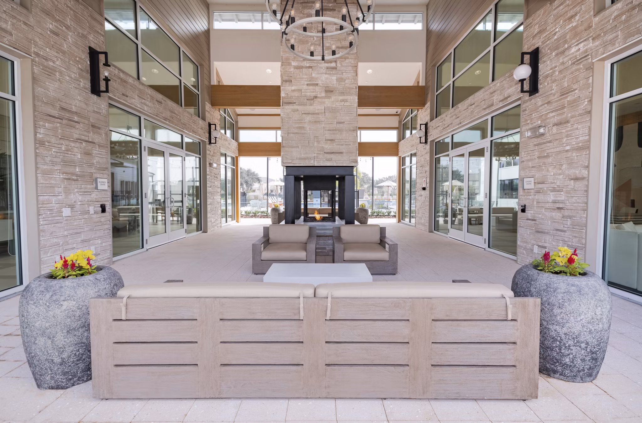 Chic outdoor patio with cozy seating at Lynwind Apartments, ideal for relaxation and socializing in a modern setting