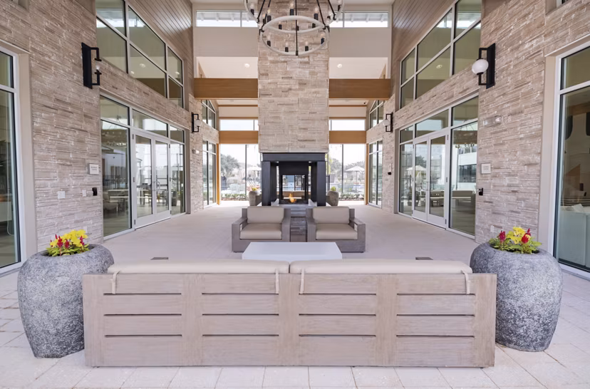 Chic outdoor patio with cozy seating at Lynwind Apartments, ideal for relaxation and socializing in a modern setting
