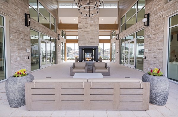Chic outdoor patio with cozy seating at Lynwind Apartments, ideal for relaxation and socializing in a modern setting