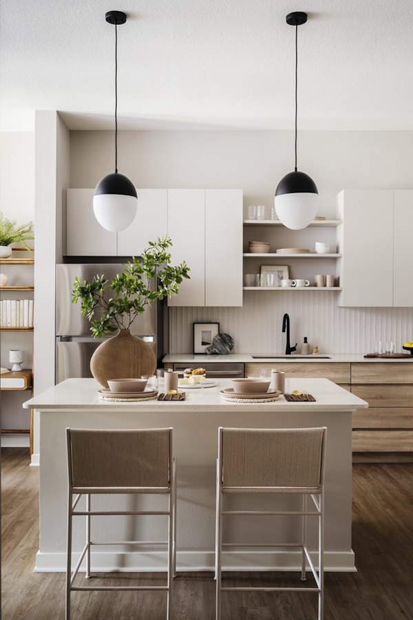 Modern kitchen with sleek countertops and stainless steel appliances at Lynwind Apartments