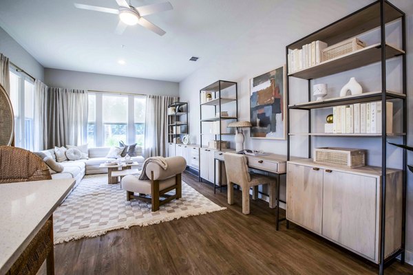 Spacious living room with modern decor at Lynwind Apartments, showcasing luxury living and comfort in a contemporary setting