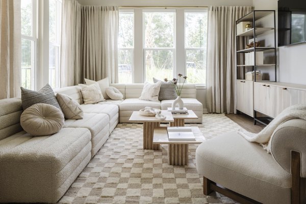 Spacious living room with modern decor and balcony view at Lynwind Apartments