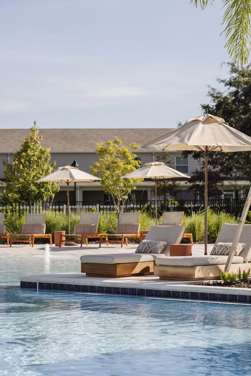 Olympic-sized pool with loungers at Lynwind Apartments, offering luxury living for residents seeking relaxation and recreation