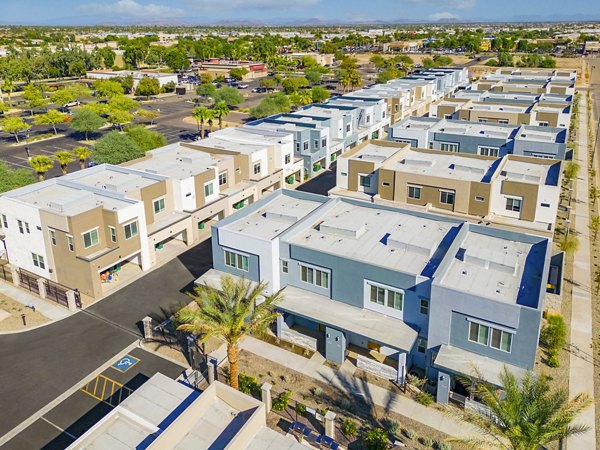 Modern townhouses with lush greenery in a tranquil residential area