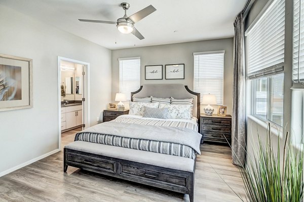 Cozy bedroom with modern decor in Town Surprise Townhome Apartments
