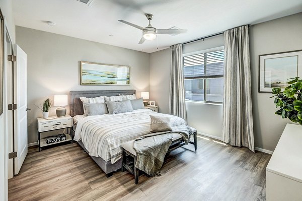 Cozy bedroom with modern furnishings at Town Surprise Townhome Apartments