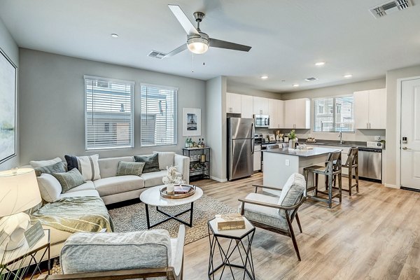 Spacious living room with modern decor in Town Surprise Townhome Apartments