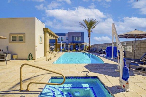 Hot tub with relaxing seating at Town Surprise Apartment Townhomes