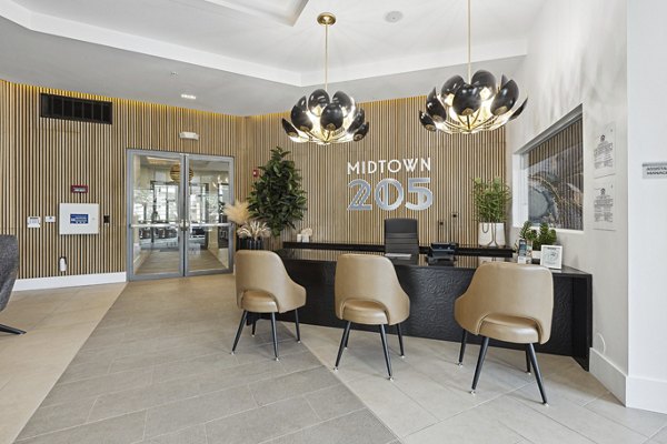 Game room with billiards table and lounge area at Midtown 205 Apartments offering luxury living in the heart of the city