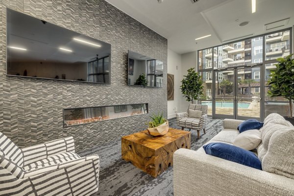Modern game room with billiards and lounge seating at Midtown 205 Apartments, ideal for luxury living and entertainment