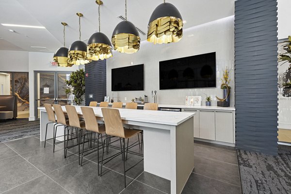 Clubhouse at Midtown 205 Apartments: Modern design with cozy seating and entertainment options in Uptown Charlotte