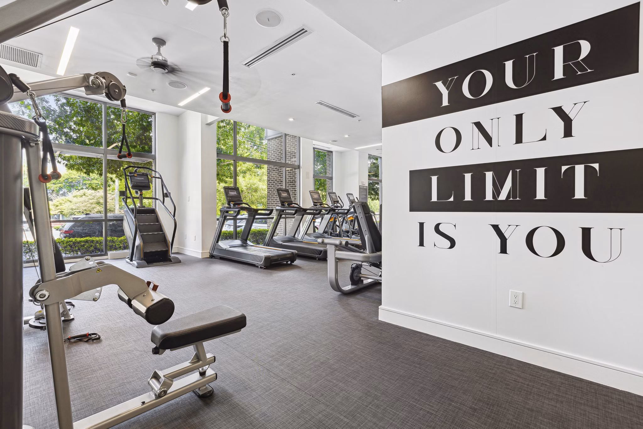 State-of-the-art fitness center featuring modern equipment at Midtown 205 Apartments