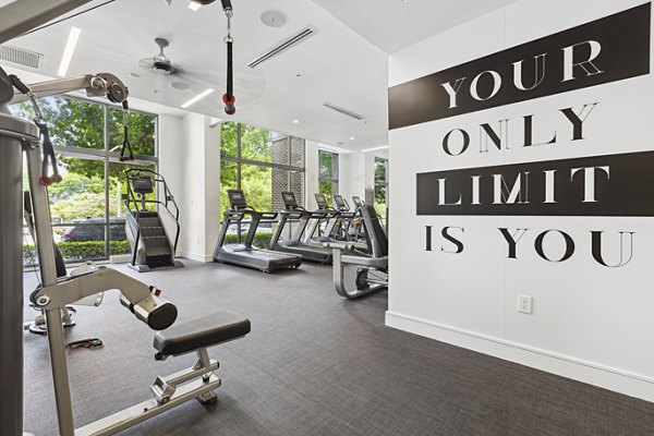 State-of-the-art fitness center featuring modern equipment at Midtown 205 Apartments