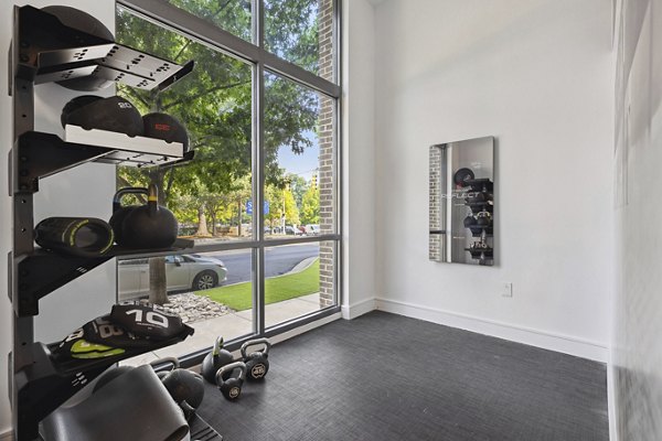 State-of-the-art fitness center with modern equipment at Midtown 205 Apartments, offering residents a premium workout experience