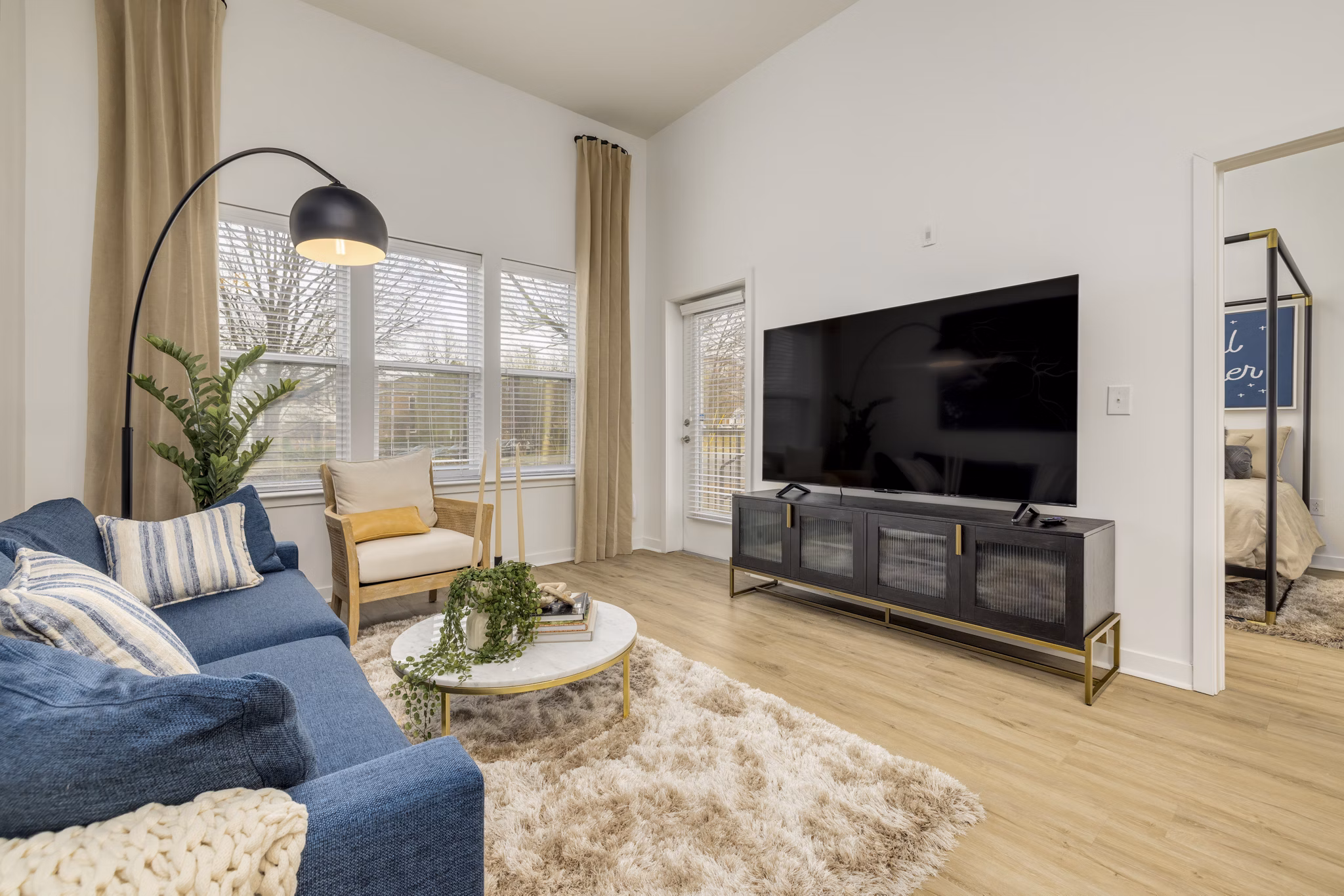 Spacious living room with contemporary furnishings in Midtown 205 Apartments
