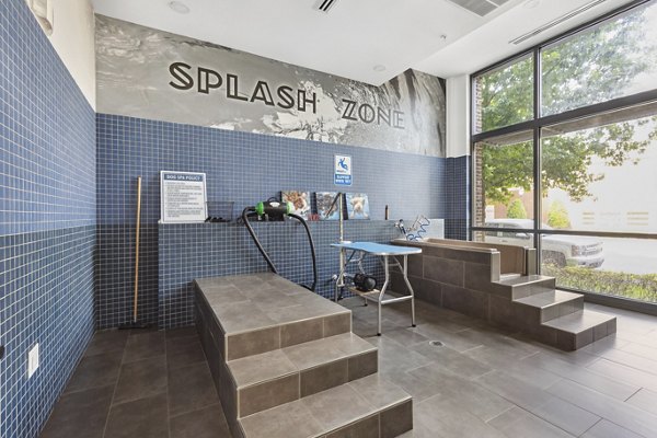 Midtown 205 Apartments: Lush courtyard with seating and greenery