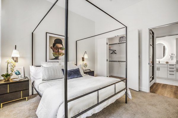 Parc Haven Apartments: Cozy bedroom with modern decor and large windows