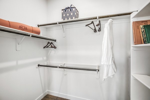Walk-in closet with custom shelving at Parc Haven Apartments