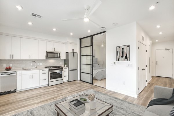 Spacious kitchen with modern appliances and stylish cabinetry in Parc Haven Apartments