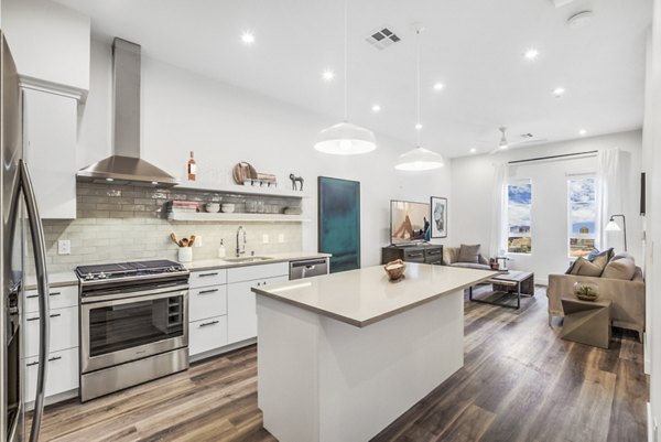 Modern kitchen with sleek countertops and stainless steel appliances at Parc Haven Apartments