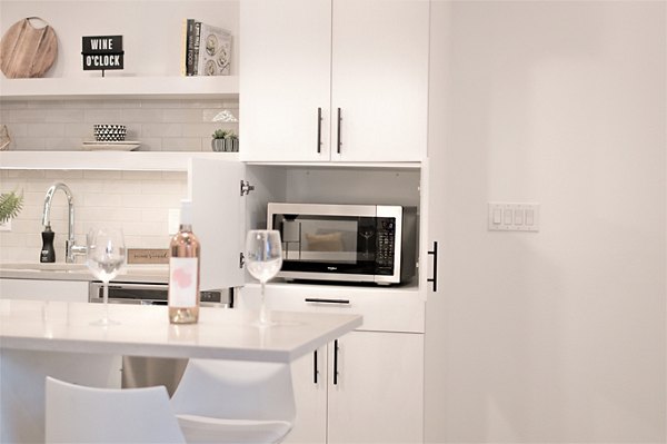 Modern kitchen with stainless steel appliances at Parc Haven Apartments