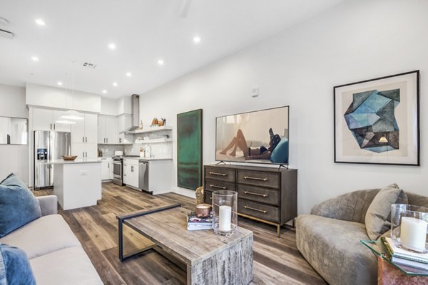 Spacious living room with modern decor and large windows in Parc Haven Apartments