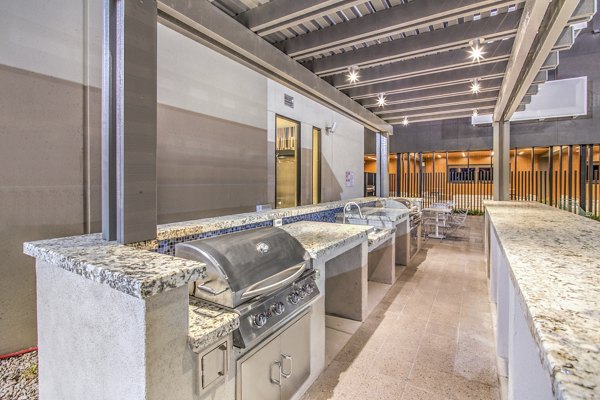 Modern grill area with seating at Parc Haven Apartments