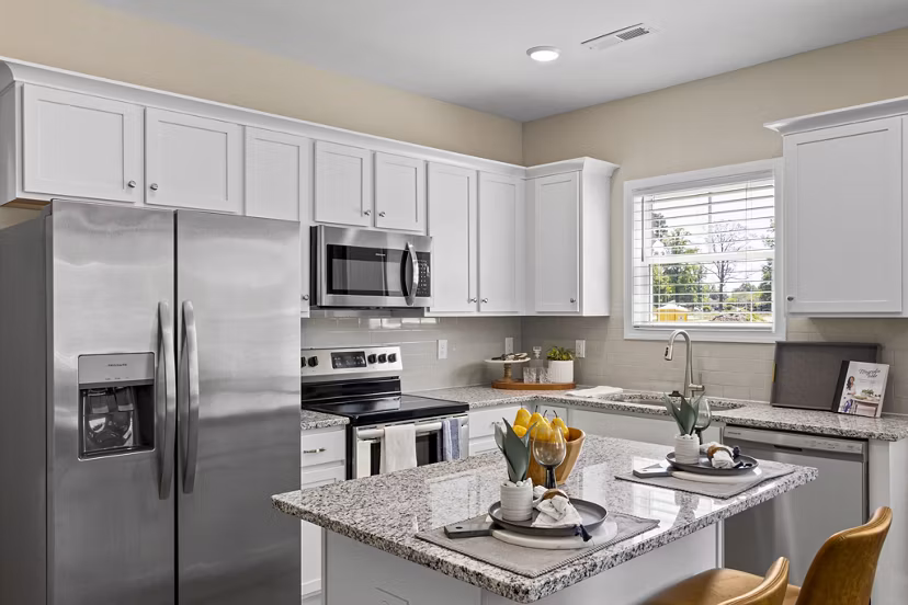 Modern kitchen with sleek countertops and stainless steel appliances at Banyan Silo Ridge Apartments