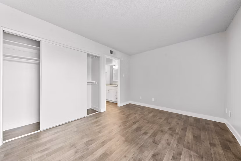 Stylish bedroom with modern decor at Verve Apartments: luxury living in a Greystar-managed community