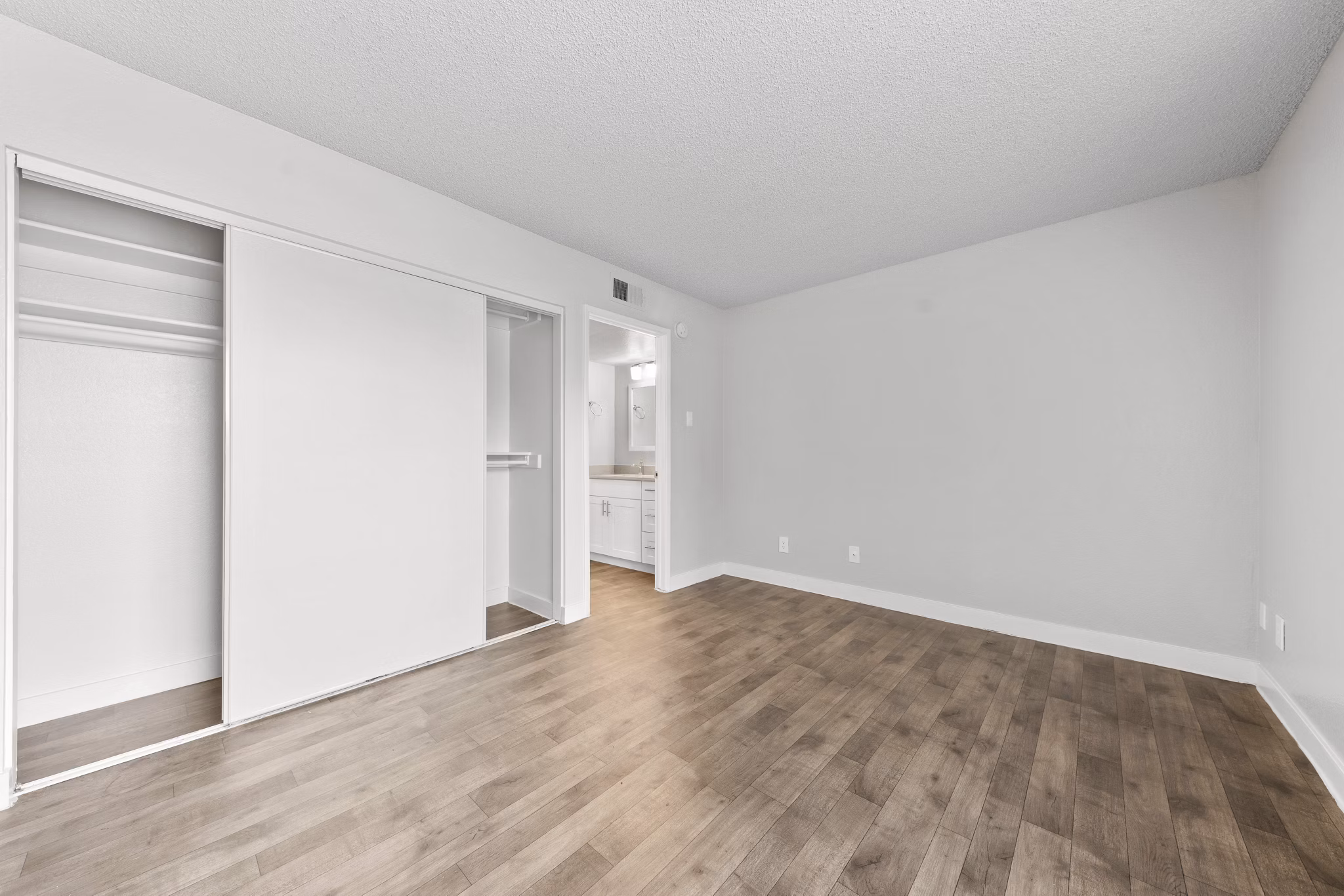 Stylish bedroom with modern decor at Verve Apartments: luxury living in a Greystar-managed community