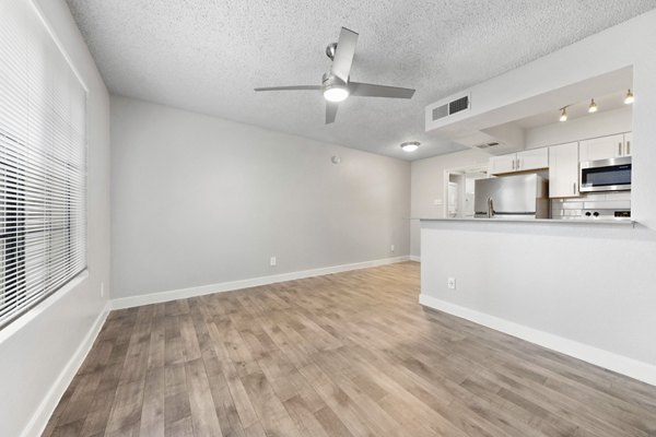 Modern kitchen with sleek countertops and stainless steel appliances at Verve Apartments