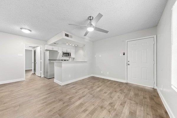 Kitchen with stainless steel appliances and granite countertops in Verve Apartments