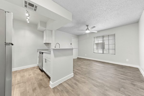 Modern kitchen featuring sleek cabinetry and stainless steel appliances in Verve Apartments