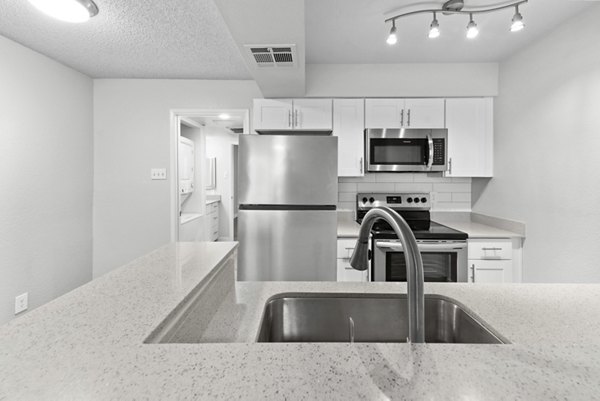 Spacious kitchen with modern appliances at Verve Apartments