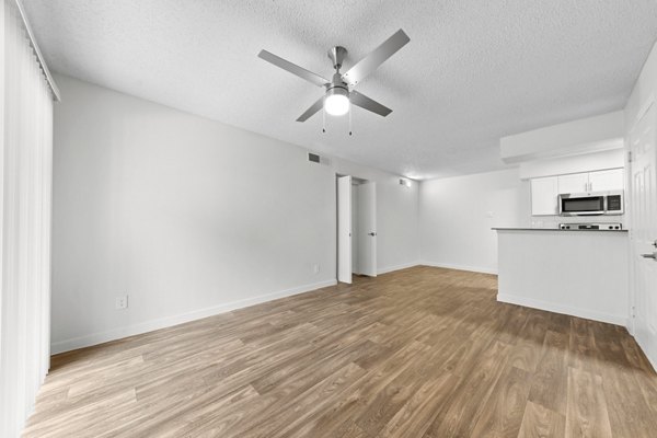 Cozy living room with modern decor at Verve Apartments featuring stylish furniture and natural lighting