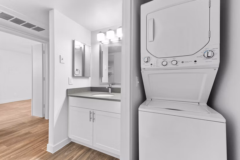Modern laundry room with high-efficiency machines at Verve Apartments