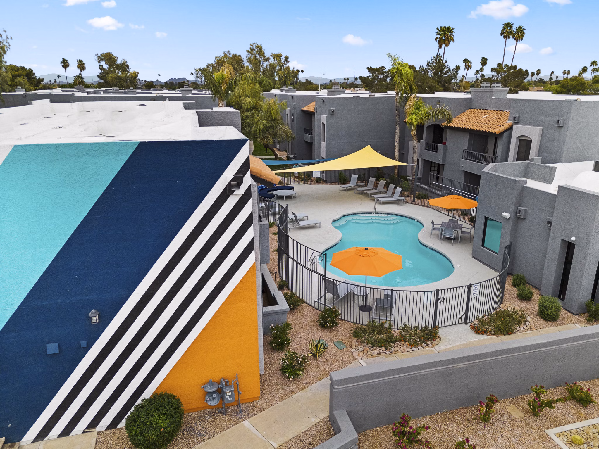 City view from Verve Apartments' rooftop at night showcasing luxury living in downtown