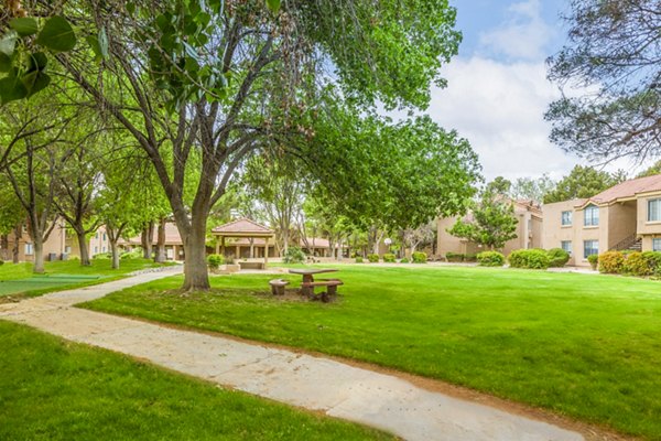 Courtyard with lush landscaping at Cinnamon Tree Apartments