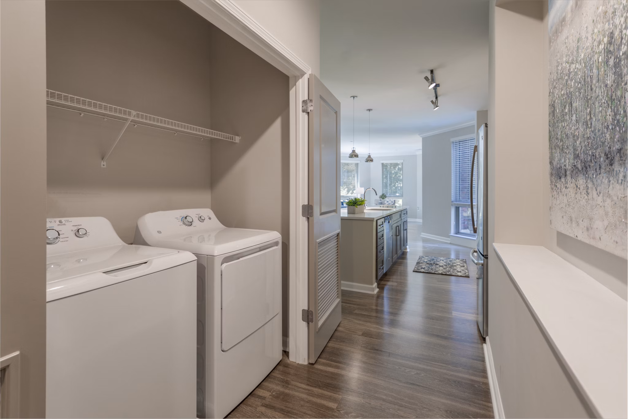 Laundry room equipped with modern appliances at Maybrook Apartments, providing convenience and efficiency for residents