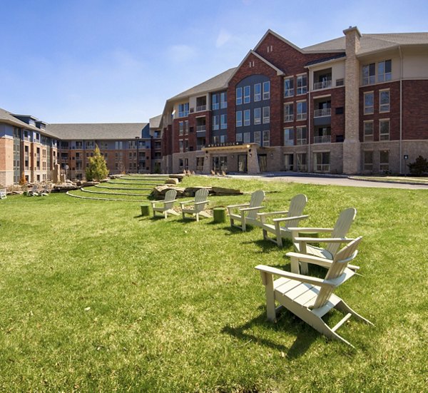 Tranquil courtyard with landscaped gardens at Maybrook Apartments, offering luxury living and relaxation spaces