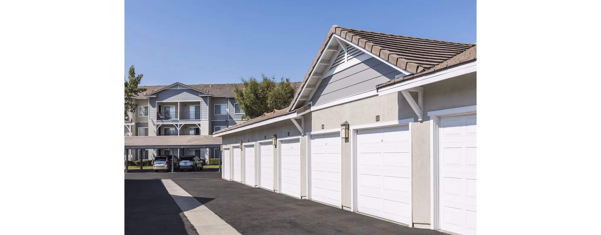 The Village on 5th: Covered parking garage at modern apartment complex