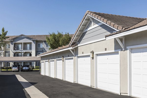 The Village on 5th: Covered parking garage at modern apartment complex