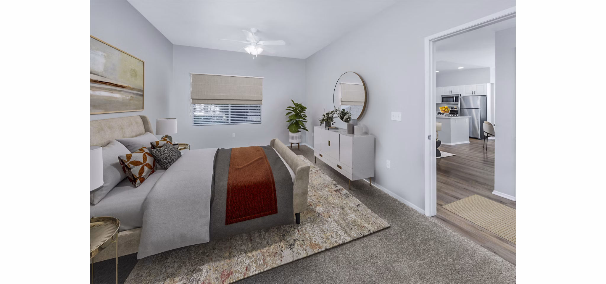 The Village on 5th Apartments: Cozy bedroom with stylish decor and ample natural light in luxury setting