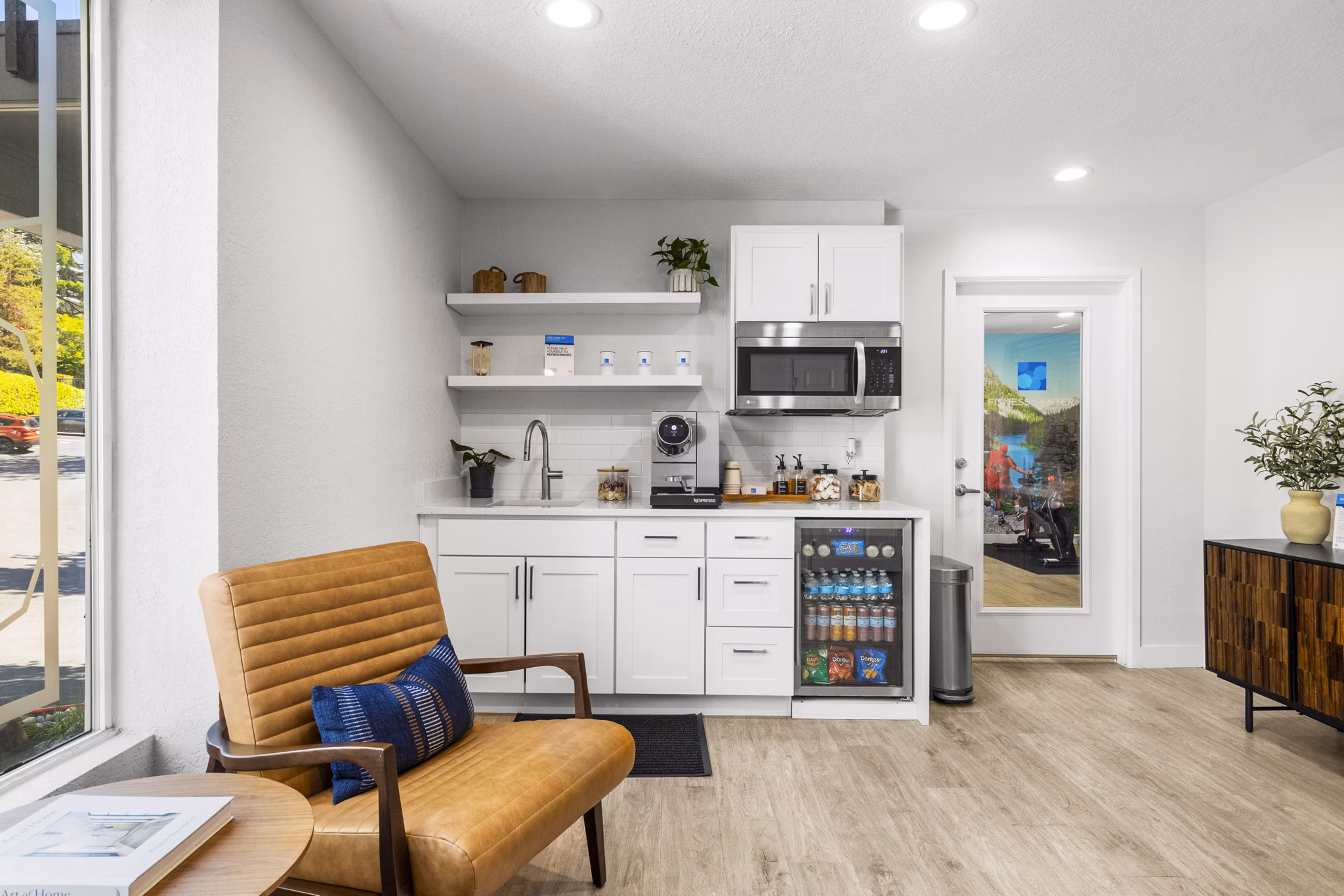 Clubhouse featuring modern lounge spaces and entertainment areas at Lakeview at Newcastle Apartments in this image from Greystar luxury apartments