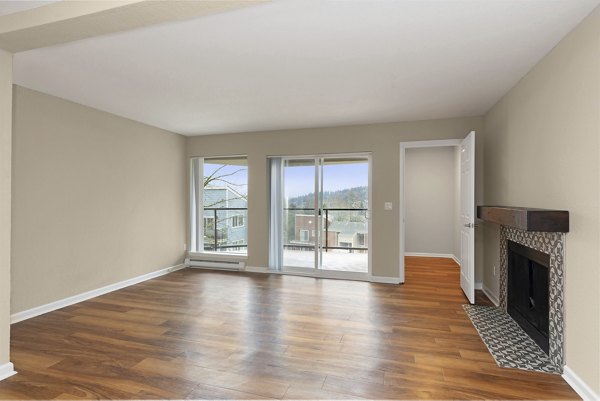 Spacious living room with modern dÃ©cor in Cedar Rim Apartments