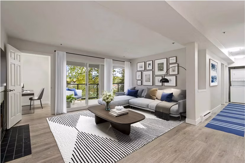 Stylish living room with modern furnishings and large windows in Lakeview at Newcastle Apartments