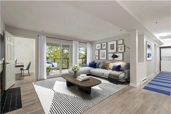 Stylish living room with modern furnishings and large windows in Lakeview at Newcastle Apartments